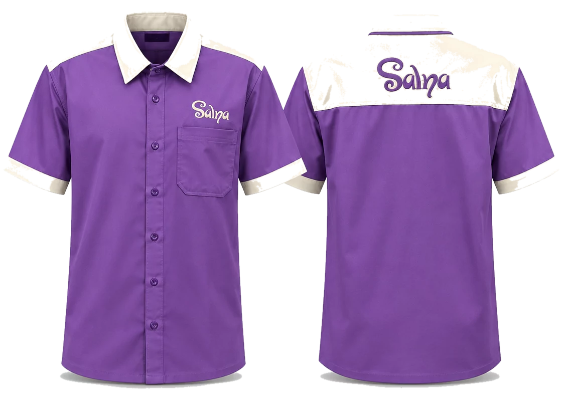 A purple and cream two-tone short-sleeve shirt, front and back, a name embroidered on the chest and across the shoulder yoke.